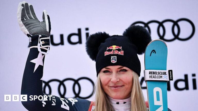 Lindsey Vonn third at Val d’Isere for third podium finish in four World Cup races Third-placed Lindsey Vonn celebrates on the podium