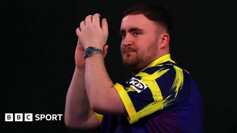 Luke Littler applauds