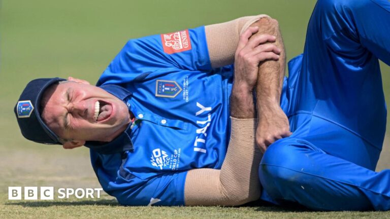 T20 World Cup: Wayne Madsen dislocates shoulder in Italy’s debut Wayne Madsen winces in pain