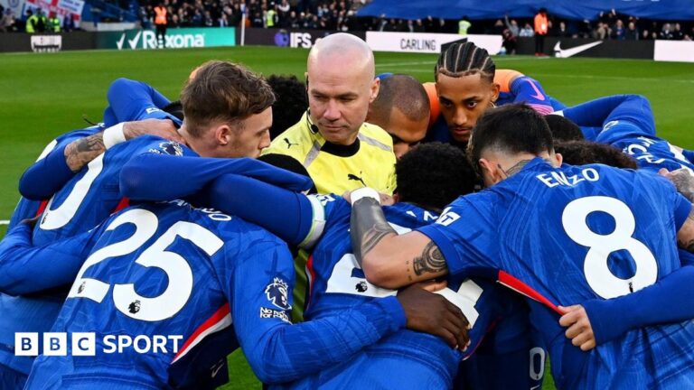 Paul Tierney in the middle of Chelsea's huddle