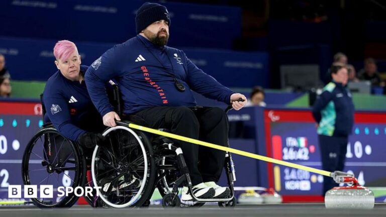 Winter Paralympics: GB wheelchair curlers lose mixed doubles opener to Estonia Great Britain's Jason Kean delivers a stone in the wheelchair curling at the Winter Paralympics with Jo Butterfield holding his chair in support