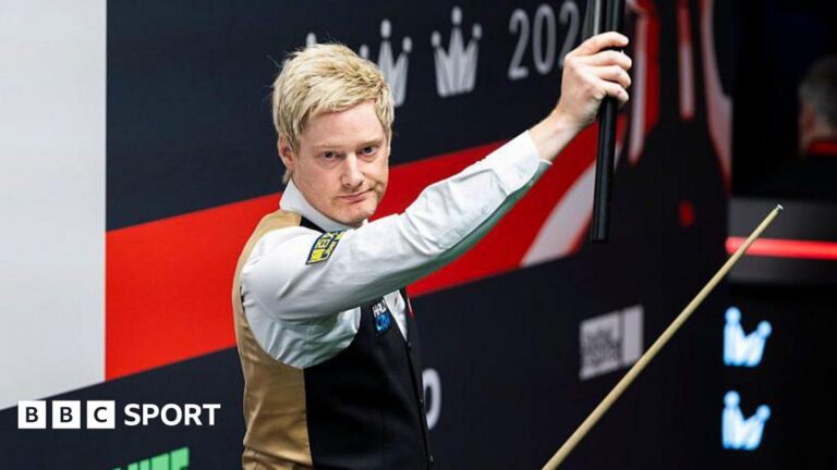 2026 World Snooker Championship: Neil Robertson victory equals Crucible seeds record Neil Robertson holds his cue extension aloft