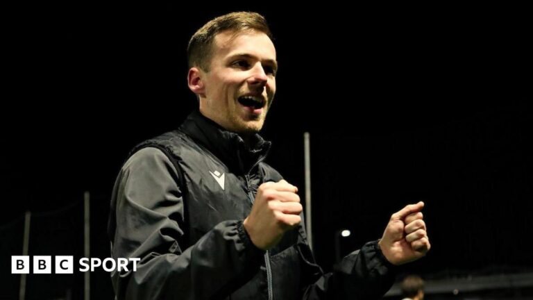 Jordan Hadaway: The 24-year-old manager who has won a top-flight promotion with Llandudno Llandudno manager Jordan Hadaway celebrates with his fists clenched
