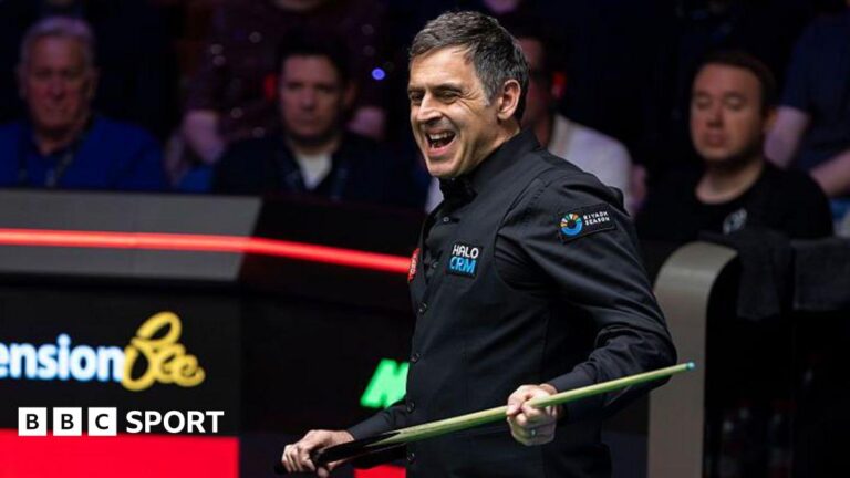Ronnie O’Sullivan in control against China’s He Guoqiang in first round of World Snooker Championship Ronnie O'Sullivan grimaces while holding his cue
