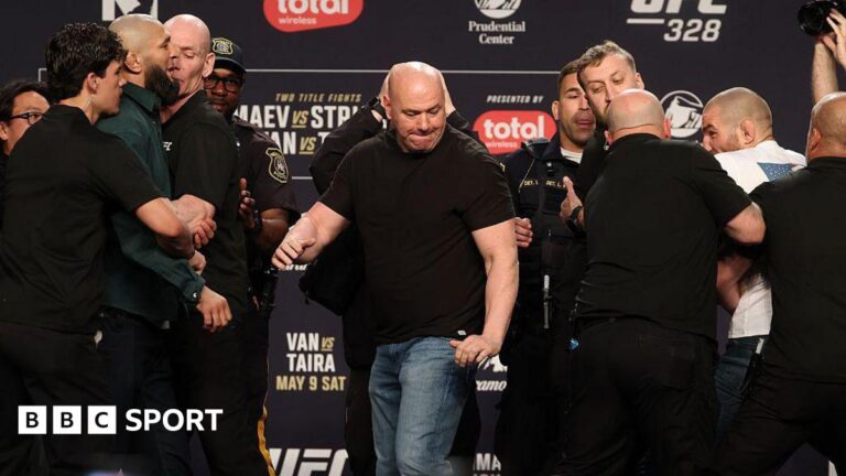 UFC 328: Khamzat Chimaev kicks Sean Strickland despite armed police presence after ugly exchange Sean Strickland and Khamzat Chimaev are held back by security at a UFC 328 news conference