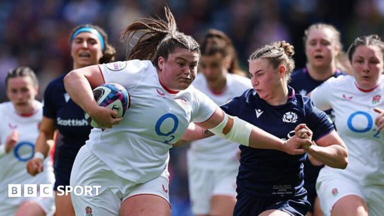 Maud Muir carries the ball