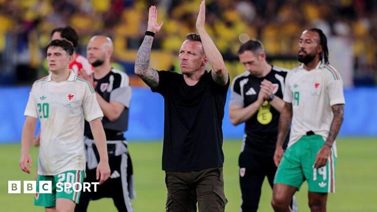 Wales boss Craig Bellamy applauds