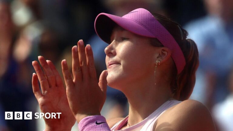 Mirra Andreeva celebrates by clapping her hands together close to ger face