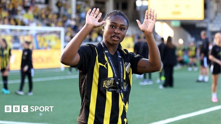Monica Jusu Bah waving to the crowd while wearing a BK Hacken kit