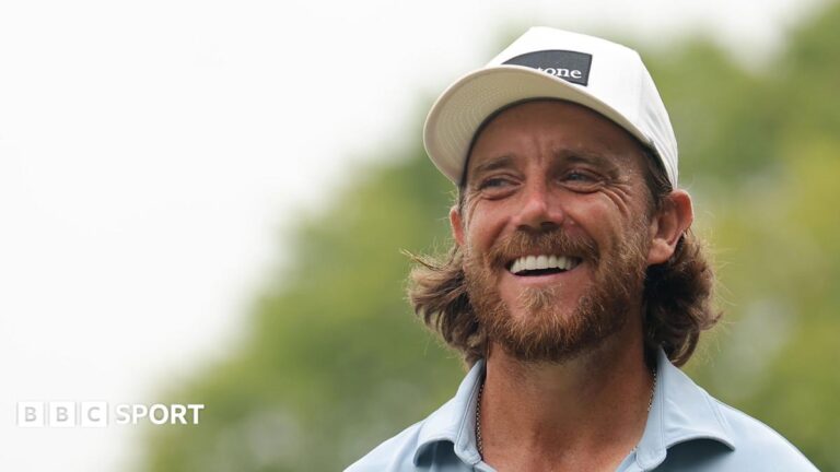 Tour Championship: Min Woo Lee leads with Tommy Fleetwood in contention Tommy Fleetwood smiles on the first tee